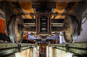 Train de la Rhune rack railway system in the garage modernised depot, Sare, France. La Rhun mountain on the border with Spain, France. Train tracks of the historic funicular from 1924 up to the summit of La Rhune Mountain, 905m, Basque Country, Pyrenees