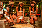 Yagua tribe located near Iquitos, Amazonian, Peru. Yaguas of the Indiana village make a demonstration of how the masato, an alcoholic beverage that is manufactured by fermenting chewing and cassava root is made.