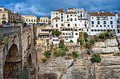 Landscape of white houses and Puente Nuevo new bridge and El Tajo Gorge, Ronda, Andalucia, Spain