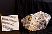 Franklinite, zincite, sphalerite & calcite minerals under normal light. USU Eastern Prehistoric Museum, Price, Utah.