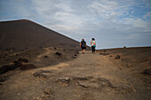 Volcan del Cuervo (Crow volcano) a crater explored by a loop trail in a barren, rock-strewn landscape