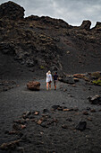 Volcan del Cuervo (Crow volcano) a crater explored by a loop trail in a barren, rock-strewn landscape