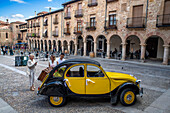 Retro yellow Citroen 2CV in Town Hall, main square, Plaza Mayor, Sigüenza, Guadalajara province, Spain
