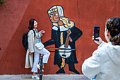 Funny medieval graffiti in the town center of Sigüenza, Guadalajara province, Spain