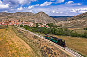 Aerial view of steam train, Utrillas mining train and Utrillas Mining and Railway Theme Park, Utrillas, Cuencas Mineras, Teruel, Aragon, Spain.