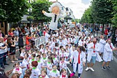 France, Hauts de Seine, Puteaux, carnival parade of children in the streets of downtown