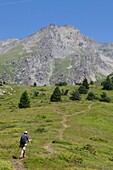 France, Isere, Valbonnais, Female hiker above the village on the Côte Belle crest