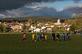 France, Doubs, at the top Doubs the village of Labergement Sainte Marie and the soccer team of the children