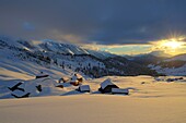 France, Haute Savoie, massif of Aravis, Le Grand Bornand, after a snowfall on the ski area in the Duche valley sunset on the hamlet of the col des Annes