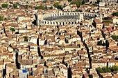 France, Bouches du Rhone, Arles, the city center with the arena, Roman amphitheater (80/90 AD J-C.), Historical monument, UNESCO World Heritage (aerial view)