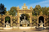 France, Meurthe et Moselle, Nancy, Stanislas square (former royal square) built by Stanislas Leszczynski, king of Poland and last duke of Lorraine in the 18th century, listed as World Heritage by UNESCO, Neptune fountain by Barthelemy Guibal and ironworks by Jean Lamour