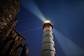 France, Finistere, Plougonvelin, Saint Mathieu point, The Saint Mathieu lighthouse rays in the night listed as Historical Monument