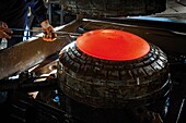 France, Pyrenees, Ariege, Niaux, Les Forges de Niaux, coin molding machine in an industrial forging