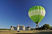 France, Loir et Cher, Valley of the Loire listed as World Heritage by UNESCO, Chambord, the Royal Castle, take off from a green balloon in front of the castle