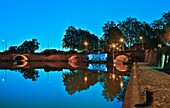 France, Haute-Garonne, Toulouse, listed at Great Tourist Sites in Midi-Pyrenees, Ponts-Jumeaux, night view of canal and twin bridges basin