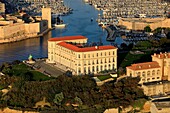 France, Bouches du Rhone, Marseille, 7th arrondissement, the Palais du Pharo, the Old Port and the Fort Saint Jean classified Historical Monument in the background (aerial view)