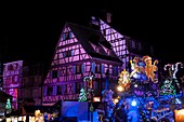 France, Haut Rhin, Colmar, Place des Six Montagnes noires, half-timbered houses, children's Christmas market, illuminations