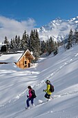 France, Haute Savoie, Massif of the Mont Blanc, the Contamines Montjoie, trails round in rackets with snow from the tracks of the Stage towards the chalet of Joux
