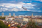 France, Isere, Grenoble, the banks of Isere river, 13th century Saint Andre church and Belledonne massif in the background
