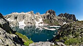 France, Haute Corse, Corte, Restonica Valley, in Regional Natural Park, panoramic view of Capitello Lake with the last snow and ice floes and the tip of 7 lakes