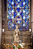 France, Puy de Dome, Auvergne Volcanoes Regional Nature Park, Monts Dore mountain range, Orcival, 12th century Notre Dame d'Orcival basilica, statuette of the Romanesque Virgin in majesty