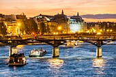 France, Paris, Seine river banks listed as World Heritage by UNESCO, a fly boat, the Passerelle des Arts and the Musee d'Orsay