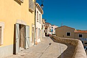 France, Herault, Meze, houses lining a pedestrian street on the south ramparts of the city
