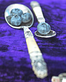Blueberries on silver spoon
