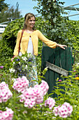 Woman entering summer garden