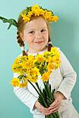 Girl holding daffodils