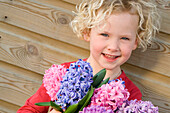 Girl holding hyacinths