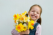 Girl holding Daffodils