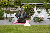 Man meditating in garden