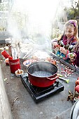 Children making apple sauce