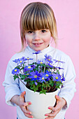 Girl holding anemone blanda