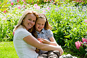 Mother and daughter in garden