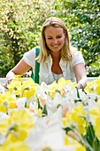 Woman enjoying daffodils