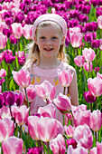 Girl in field of tulips