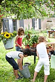 Children planting vegetable plants