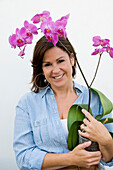 Woman holding Phalaenopsis