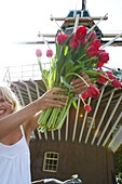 Woman holding tulips