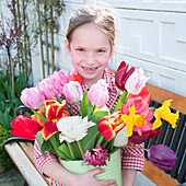 Girl holding spring bouquet