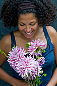 Woman holding dahlia