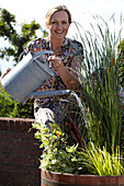 Woman watering container