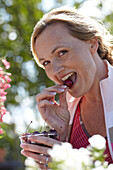 Woman eating cherry