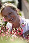 Woman touching Penstemon