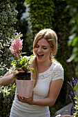 Woman holding Astilbe