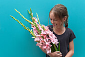 Girl holding Gladiolus