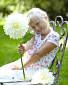 Girl holding dahlia