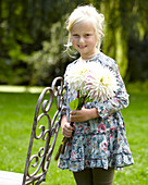 Girl holding dahlia